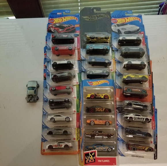 27 hot wheels cars and one that makes 28 out of the container. - Picture 2 of 3